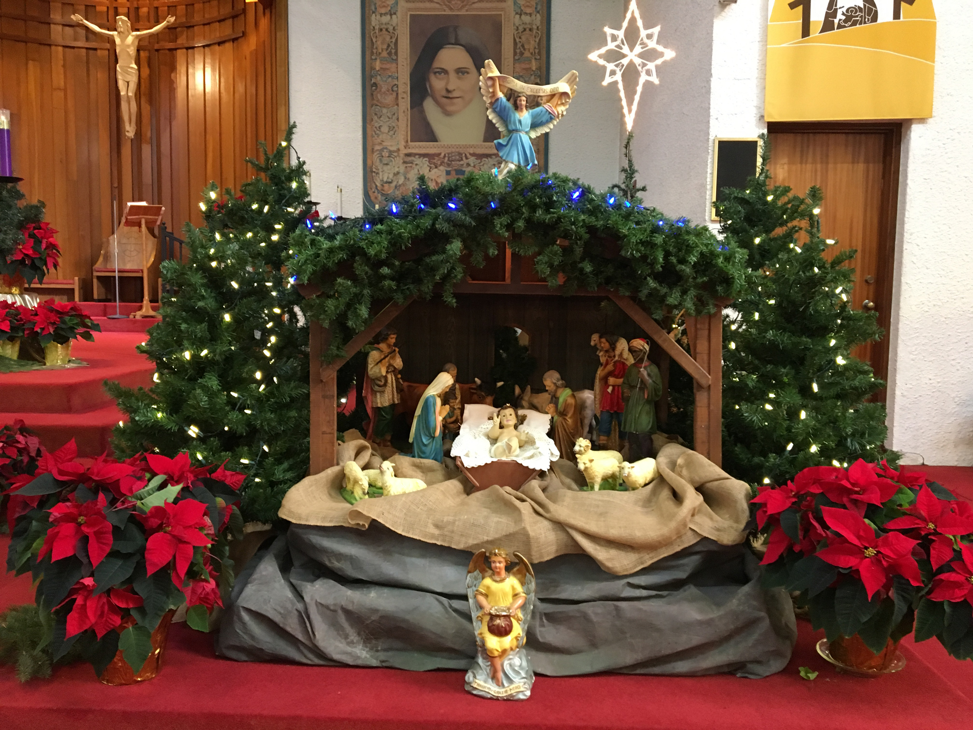 A nativity scene in front of St. Theresa's Parish church altar