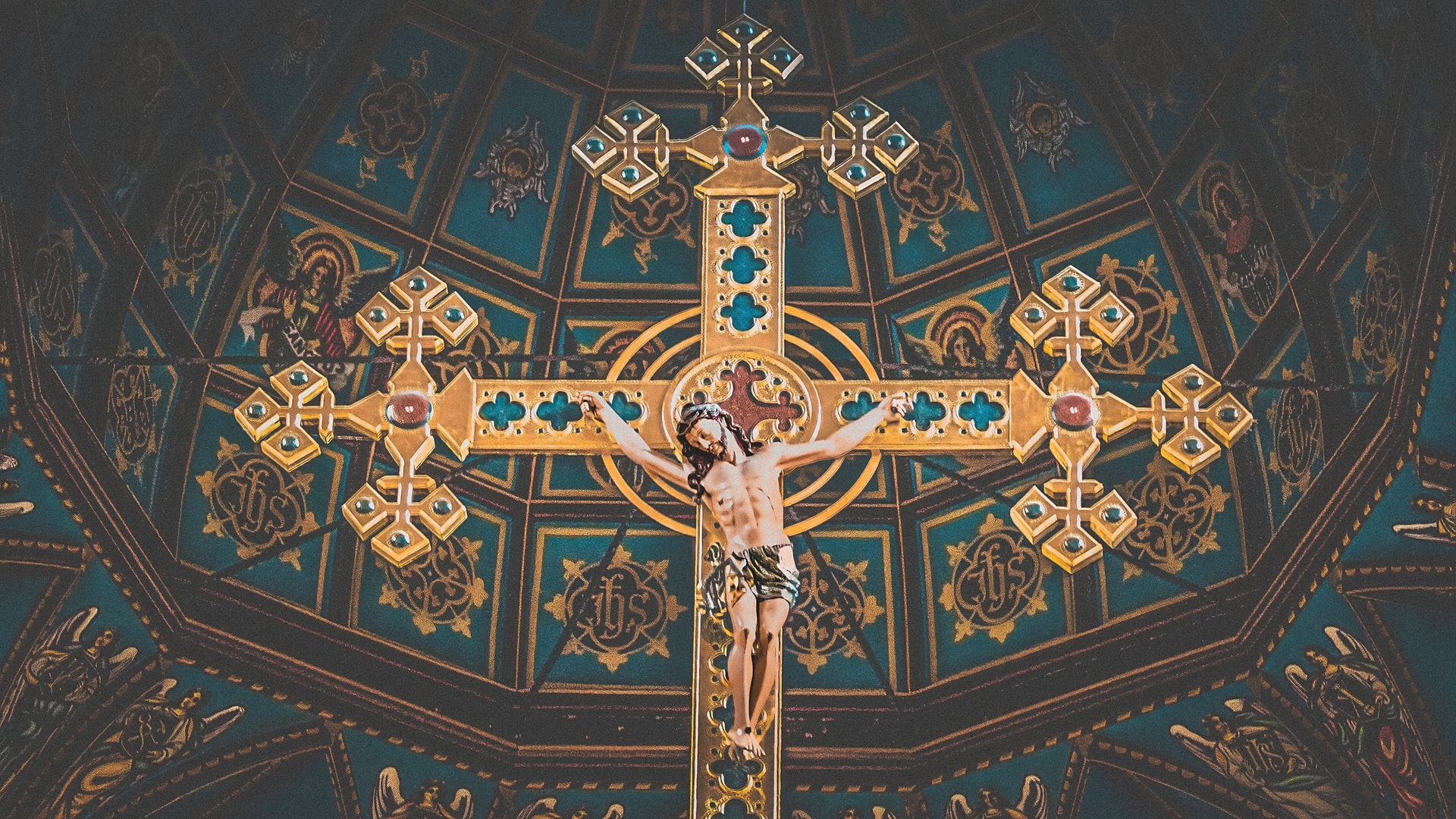 A crucifix hanging from the ceiling of a Catholic church