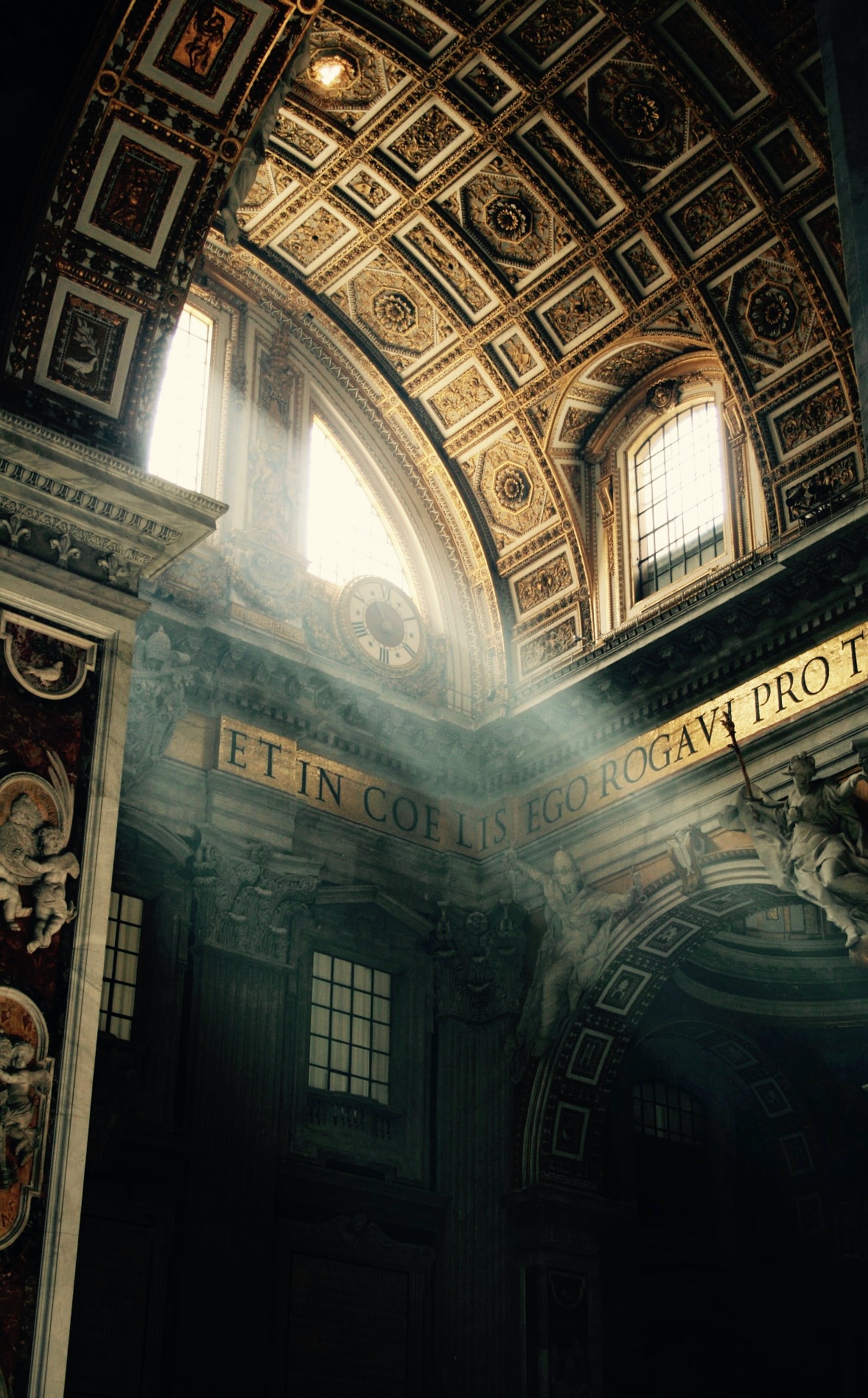 Light passes through a window at St. Peter's Basilica